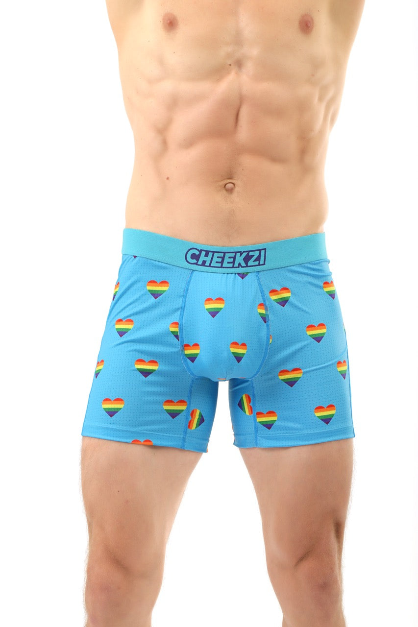 Sky blue men’s briefs with colorful rainbow heart print, offering inclusive style with soft, comfortable fabric.