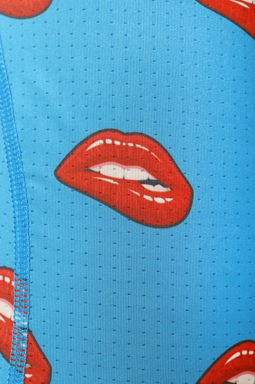 Sky blue underwear featuring bold red lip print, playful and soft fabric for a cheeky and comfortable fit.